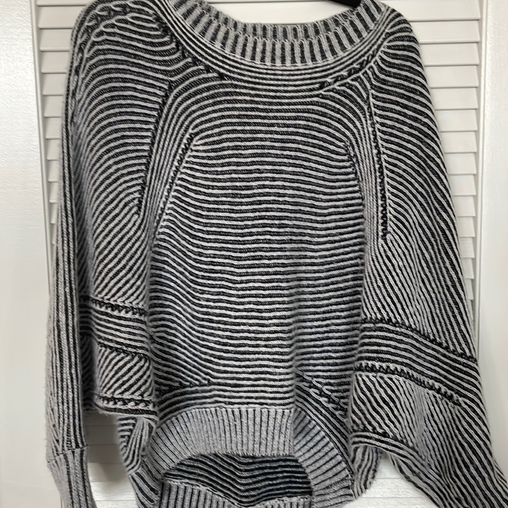 Navy and white knit poncho sweater with sleeves